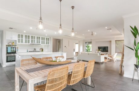 Spacious open-concept layout with modern kitchen, dining area, and living room.