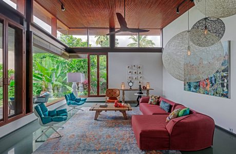 Vibrant, tropical-inspired living space with modern architecture, furnishings, and decor.