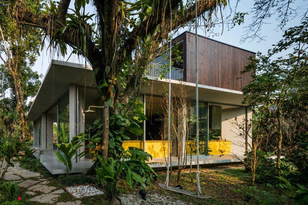 Striking modern architecture blends seamlessly with lush tropical surroundings.