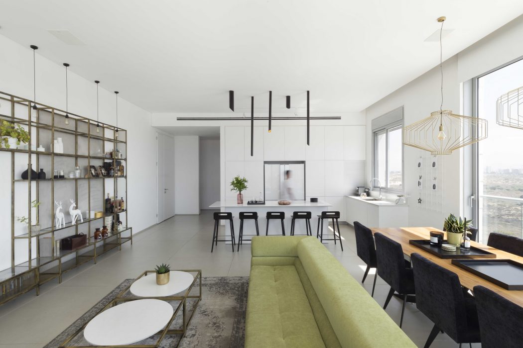 Elegant open-concept living room with sleek modern furnishings and lighting.