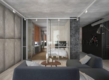 Minimalist studio apartment with concrete walls, glass dividers, and wood accents.