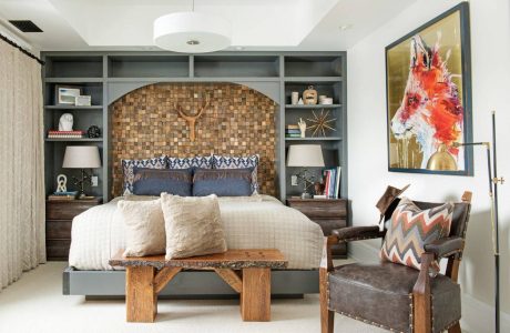 Rustic bedroom features a wooden mosaic headboard, built-in shelving, and contemporary furnishings.