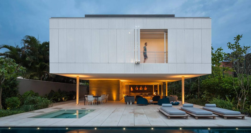Sleek modern home with cantilevered second floor, pool, and inviting outdoor lounge space.