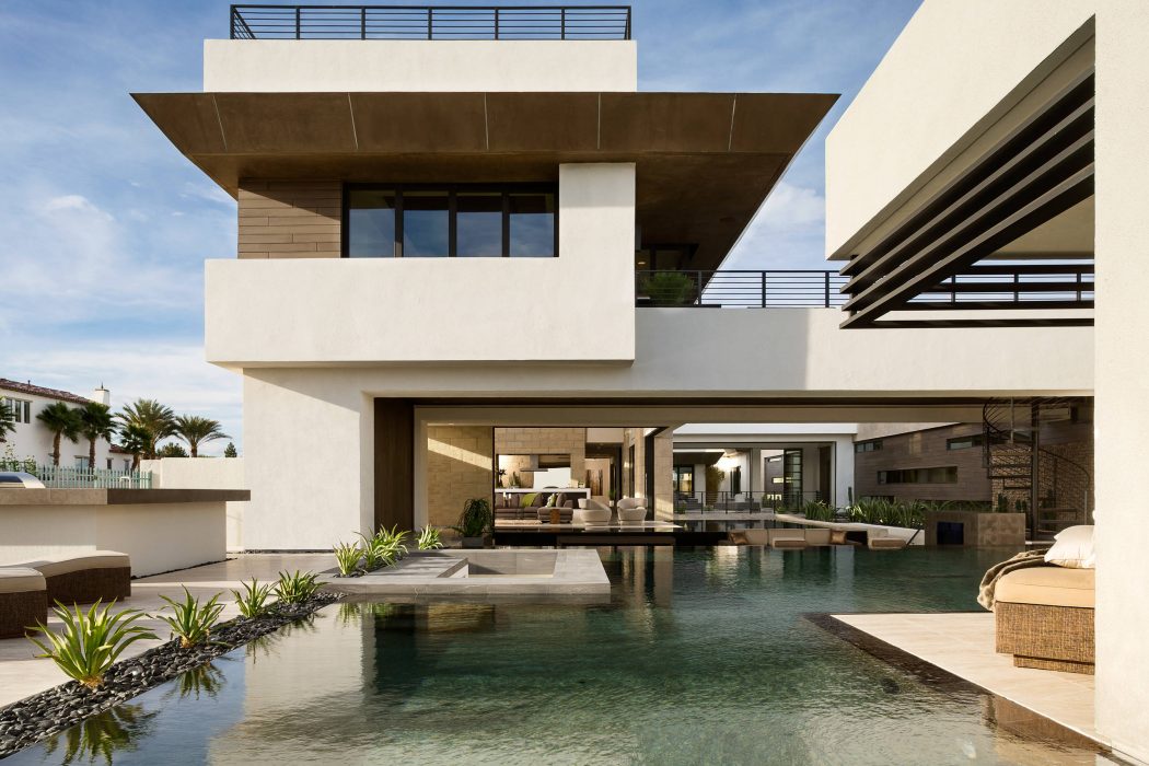 Stunning modern villa with minimalist design, sleek pool, and open living spaces.