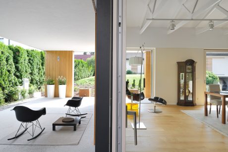 Spacious modern home with sleek furnishings, large windows, and a well-designed outdoor area.