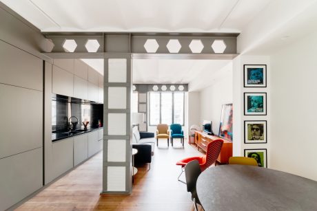 Minimalist kitchen design with geometric cabinetry and bright, colorful furnishings.