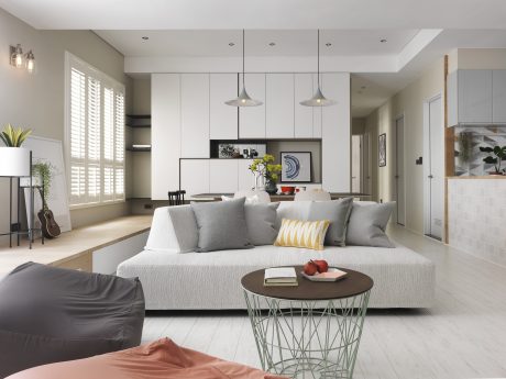 Bright, minimalist living room with sleek furnishings, modern lighting, and a welcoming atmosphere.