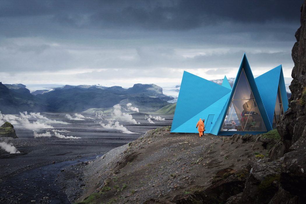 Striking blue geometric structures nestled in a rugged, mountainous landscape.