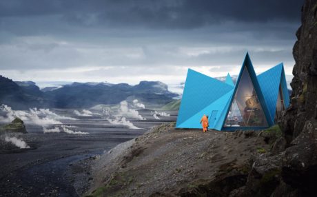 Striking blue geometric structures nestled in a rugged, mountainous landscape.