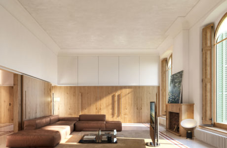 A minimalist living space with wooden paneling, a modern sectional sofa, and a sleek fireplace.