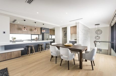 Spacious open-plan kitchen-dining area with modern, minimalist design elements.