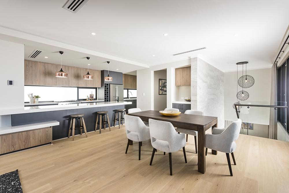 Spacious open-plan kitchen-dining area with modern, minimalist design elements.