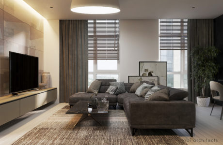 A cozy, modern living room with a plush sofa, minimalist furnishings, and natural lighting.