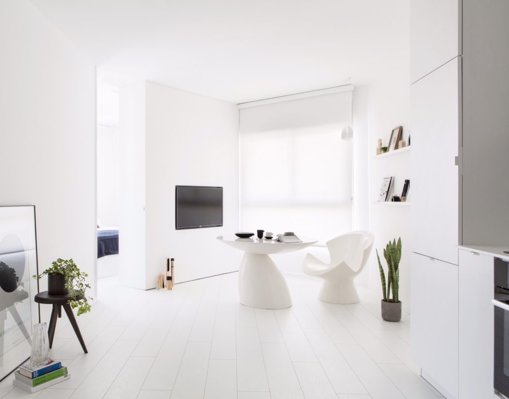 A minimalist, modern interior with clean lines, white walls, and sleek furnishings.