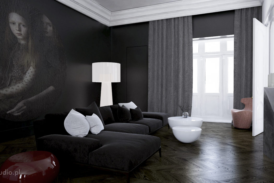 Elegant dark-toned living room with plush seating, statement lighting, and artistic elements.