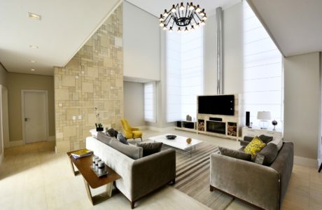 Spacious living room with a modern fireplace, built-in shelves, and a stylish chandelier.