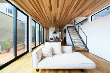 Sleek home interior with wood accents and staircase.