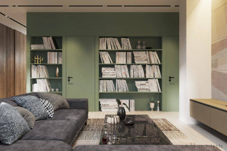 Cozy living room with built-in bookshelves, modern furnishings, and a glass-top coffee table.