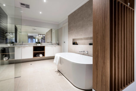 Modern bathroom with a freestanding bathtub and wooden accents.