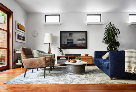 Modern living room with furniture and wall art.