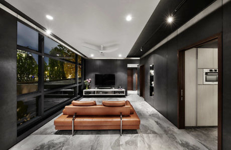 Contemporary living room with sleek design and tan leather couch.