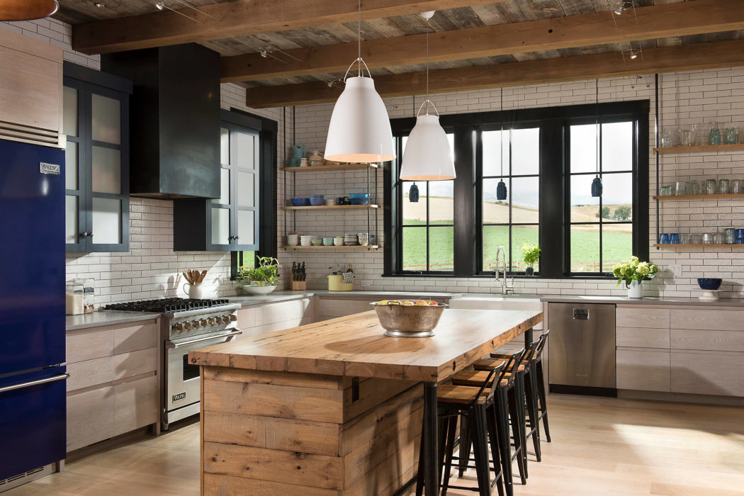 Rustic-inspired kitchen with wood accents and pendant lighting.