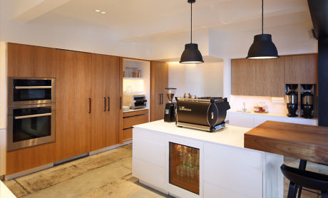 Contemporary kitchen with wood accents and pendant lighting
