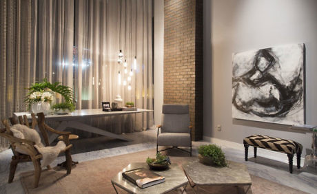 Contemporary interior with eclectic furnishings and abstract art.