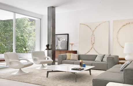 Contemporary living room with minimalist decor and natural light.