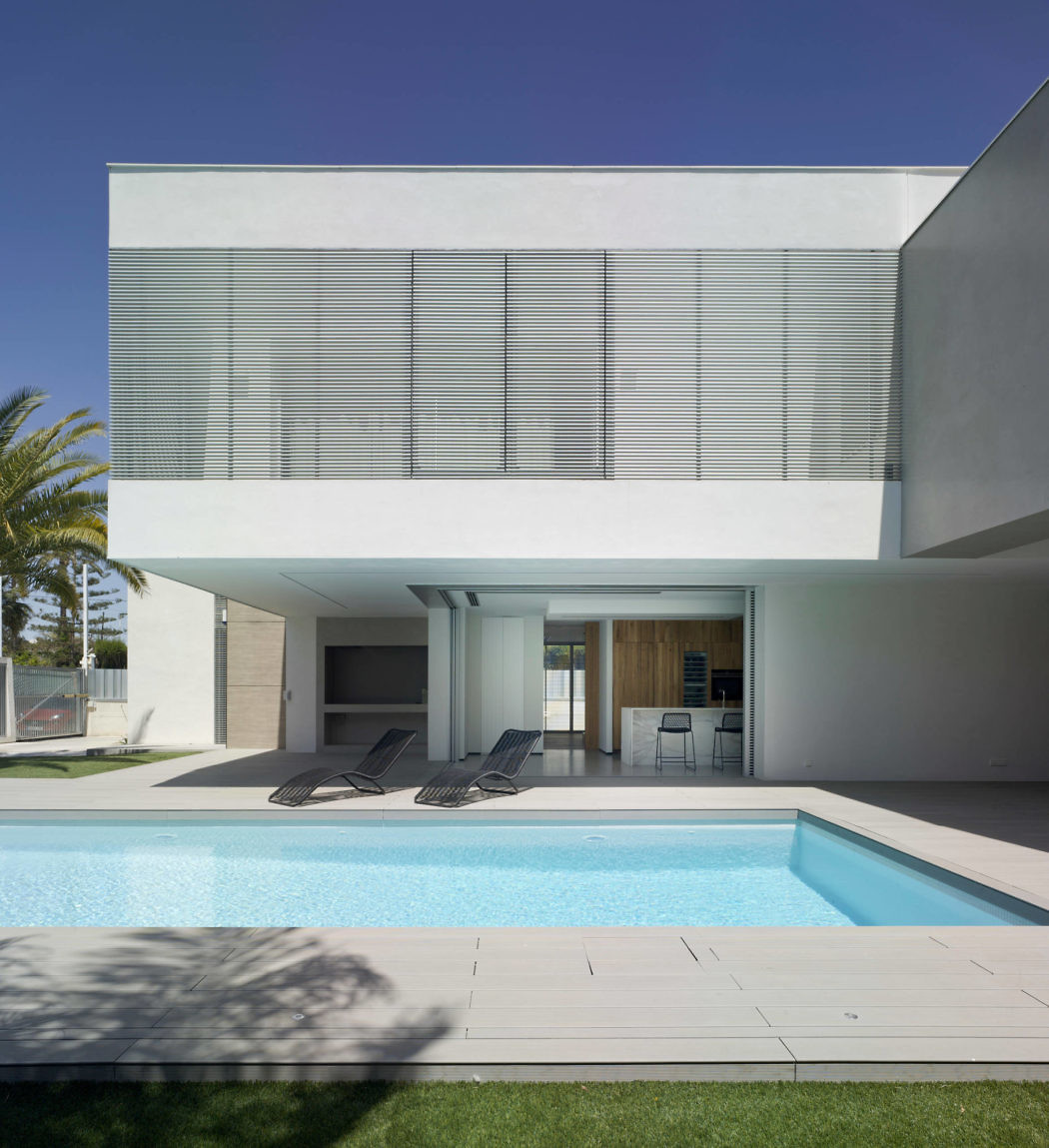 Contemporary home with pool, geometric lines, and minimalist design.
