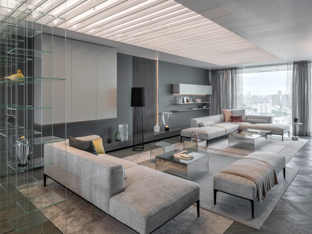 Modern living room interior with gray furniture and city view.