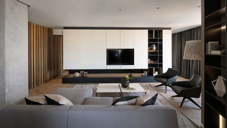 Modern living room with minimalist design, neutral tones, and sleek furniture.