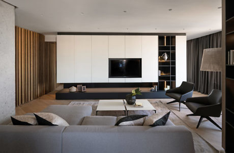 Modern living room with minimalist design, neutral tones, and sleek furniture.