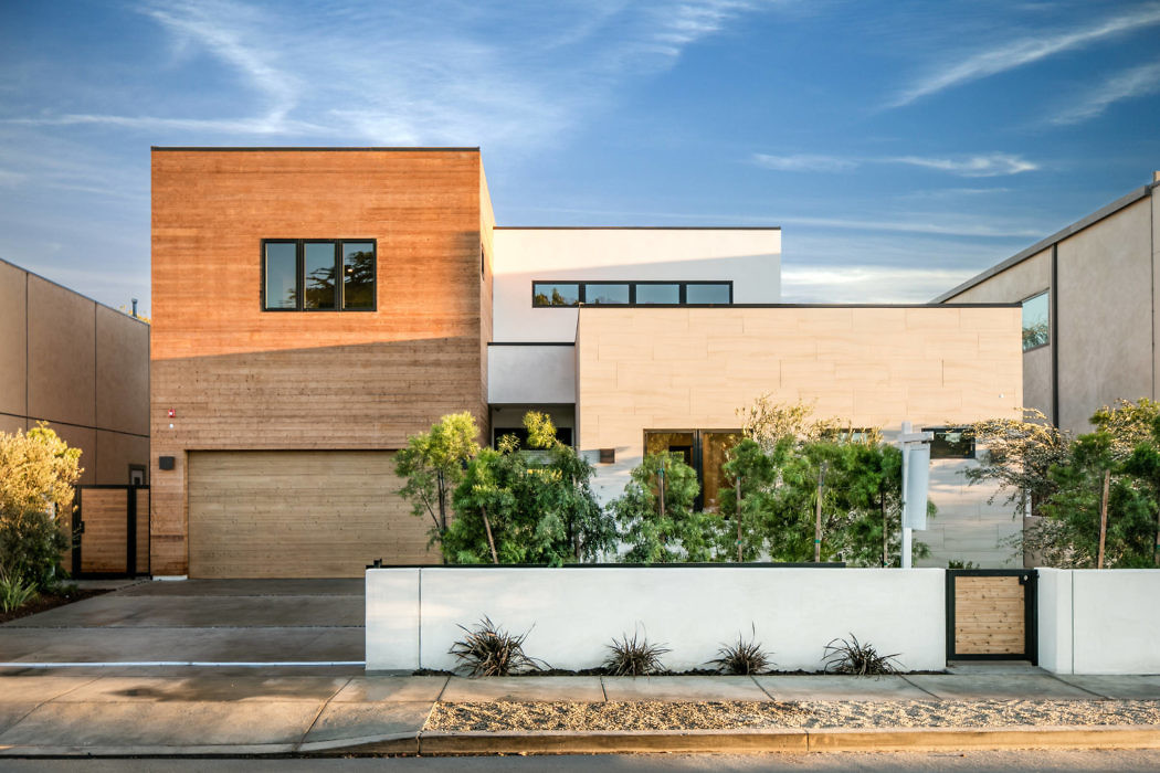 Contemporary house with mixed wood and concrete facade.