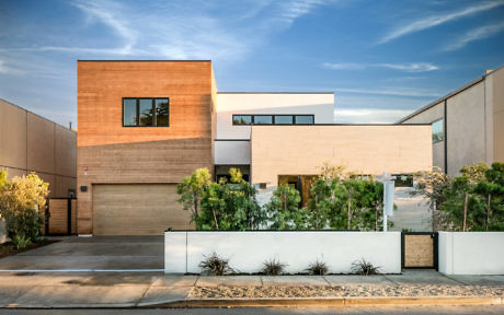 Contemporary house with mixed wood and concrete facade.