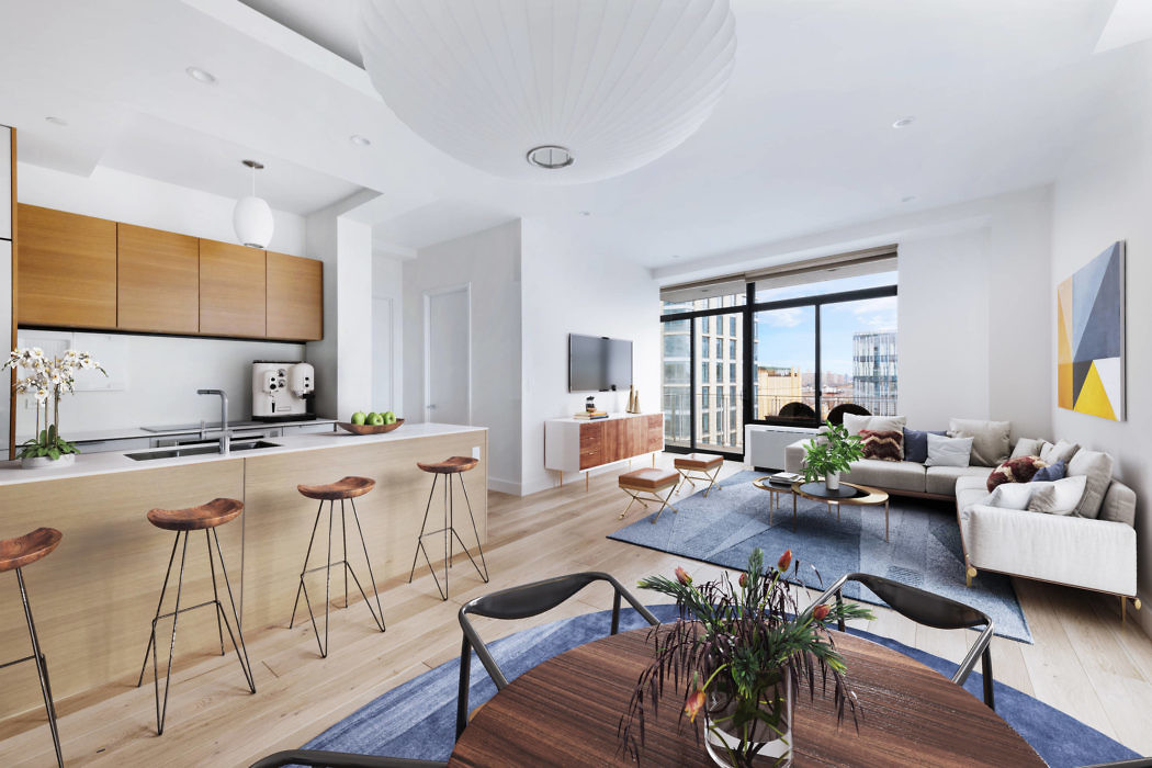 Sleek open-plan living space with wooden accents and city view.