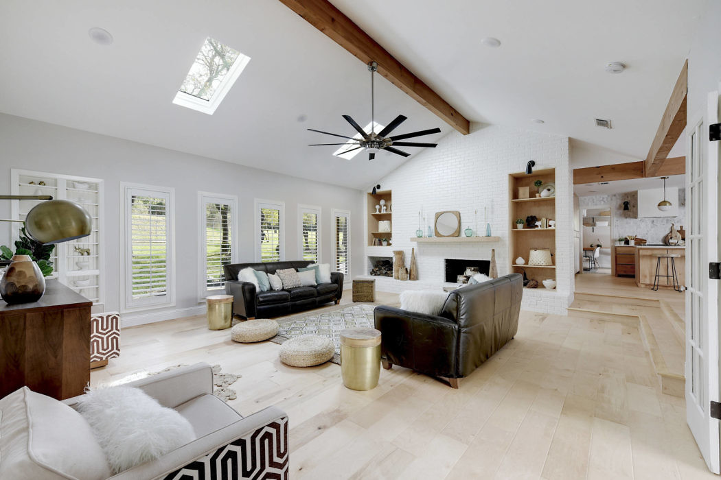 Bright, airy living space with vaulted ceilings and chic decor.