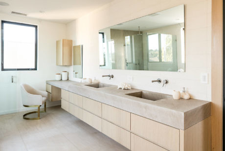 Contemporary bathroom with dual-sink vanity and minimalist decor.