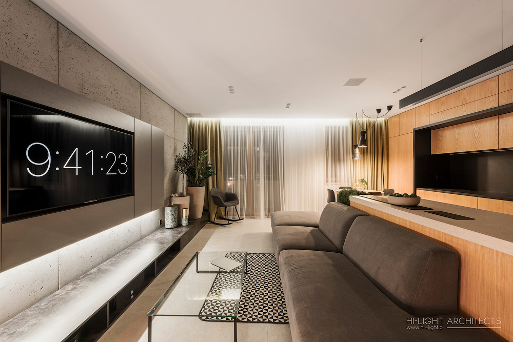 Contemporary living space with sleek design and a large digital clock display.