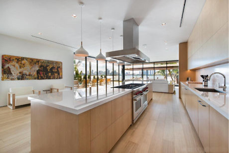 Modern kitchen interior with sleek design and a large island.