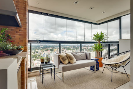 Modern living room with large windows and a city view.