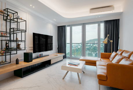 Contemporary living room with sleek furniture and a mountain view.