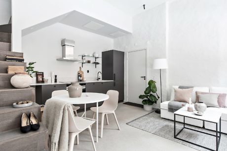 Sleek, minimalist living space with monochrome palette and clean lines.