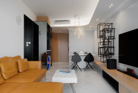 Contemporary living space with sleek furnishings and white marble flooring.