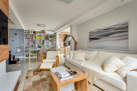 Contemporary living room with white sofa and gallery wall