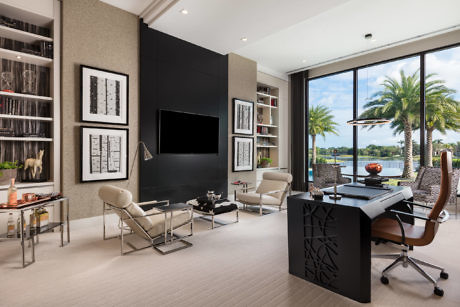 Contemporary home office with sleek furnishings and a tropical view.