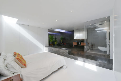 Sleek bedroom with seamless transition to ensuite bathroom.