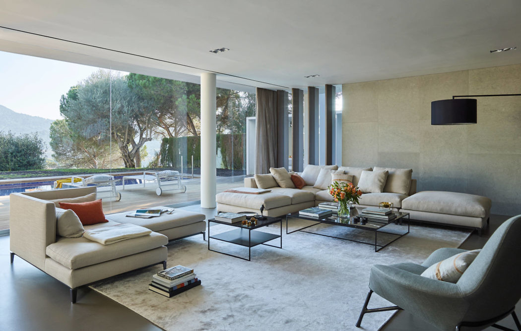 Sleek living room with minimalist decor and expansive windows.