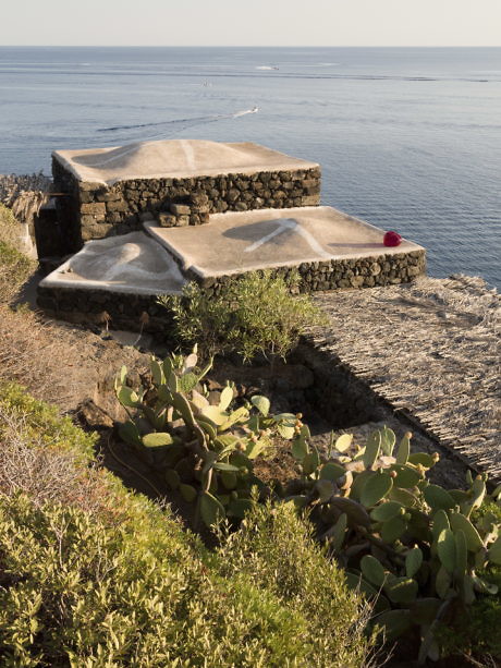 Coastal stone structure blending into natural landscape