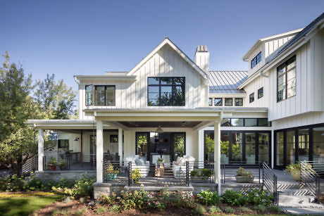 Contemporary house with large windows and a covered porch.